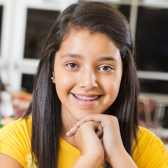 Teen with braces smiling