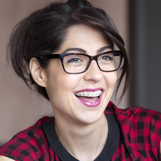 Young woman with adult orthodontics smiling