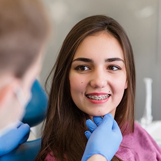 a close-up of an orthodontic patient smiling