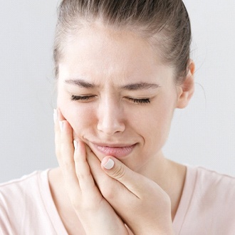 Closeup of girl experiencing tooth pain