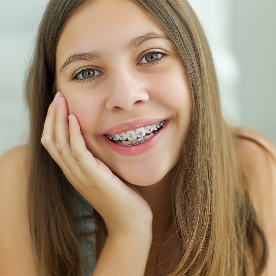 Smiling teen with self ligating braces