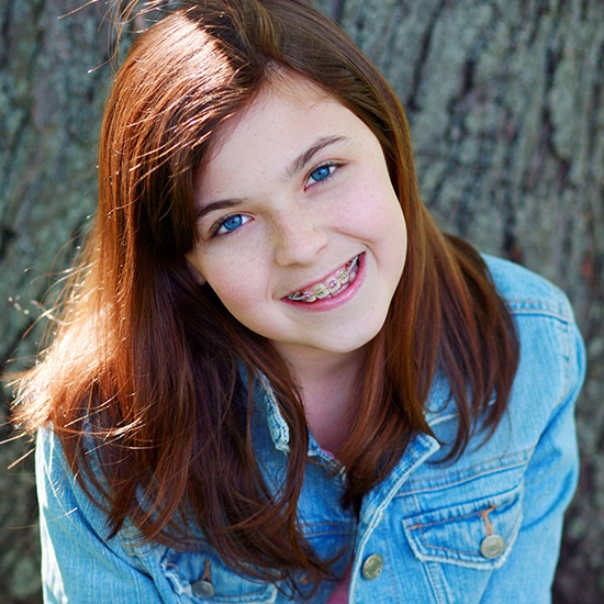 Smiling teen girl with traditional braces