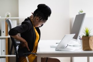 Woman suffering from bad posture and bad bite alignment