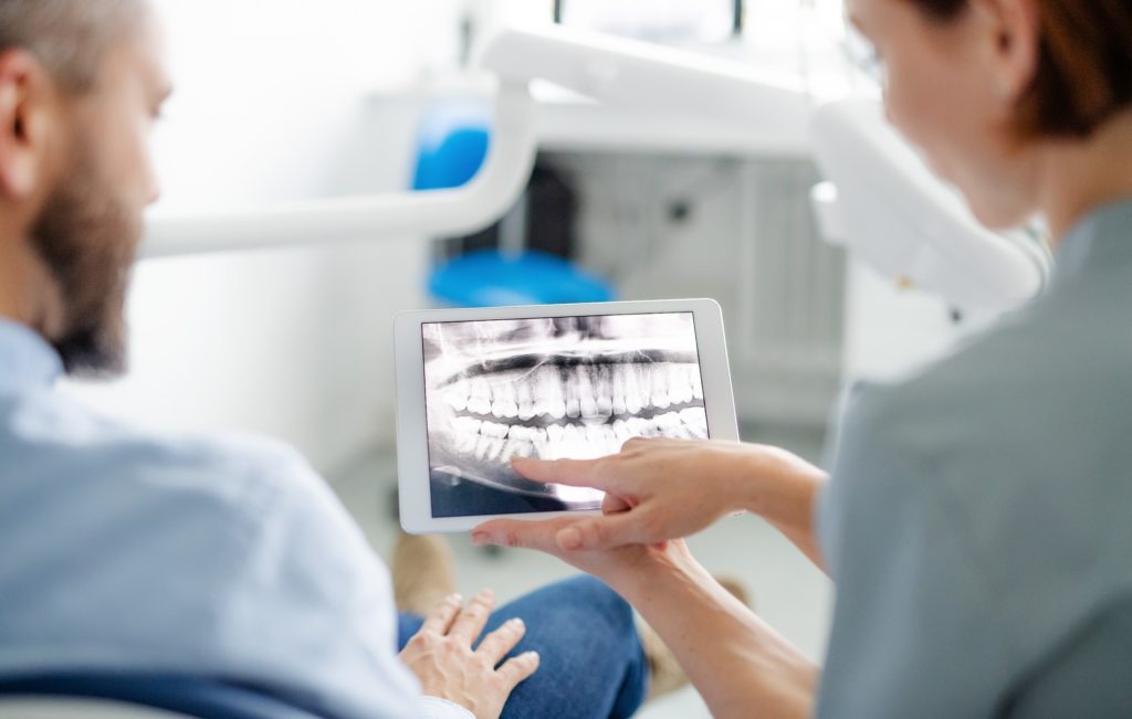 Orthodontist showing patient X-ray